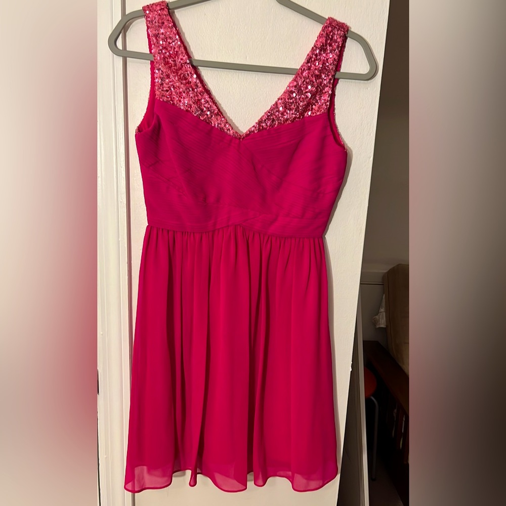 Hot pink v-neck dress with sequined details on straps. Size small. Never worn.